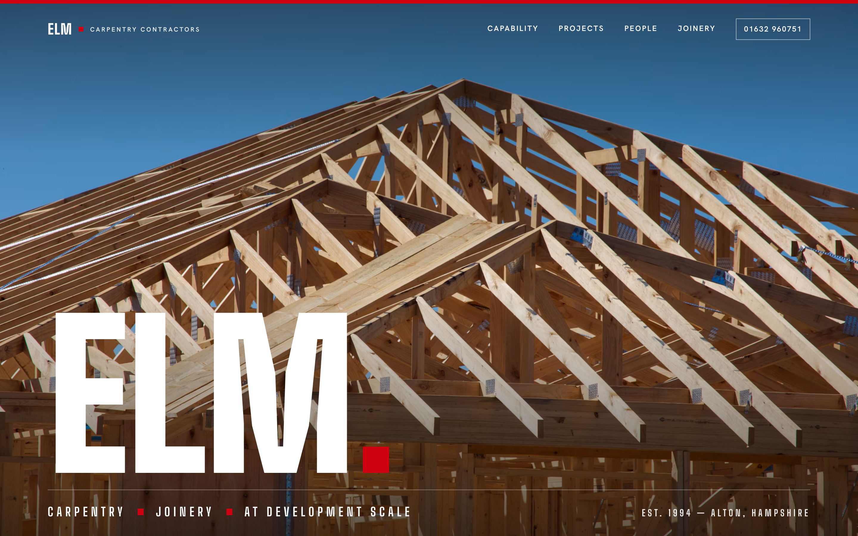 Homepage design concept for a carpentry contractor: the ELM wordmark set large over a timber roof frame against a blue sky