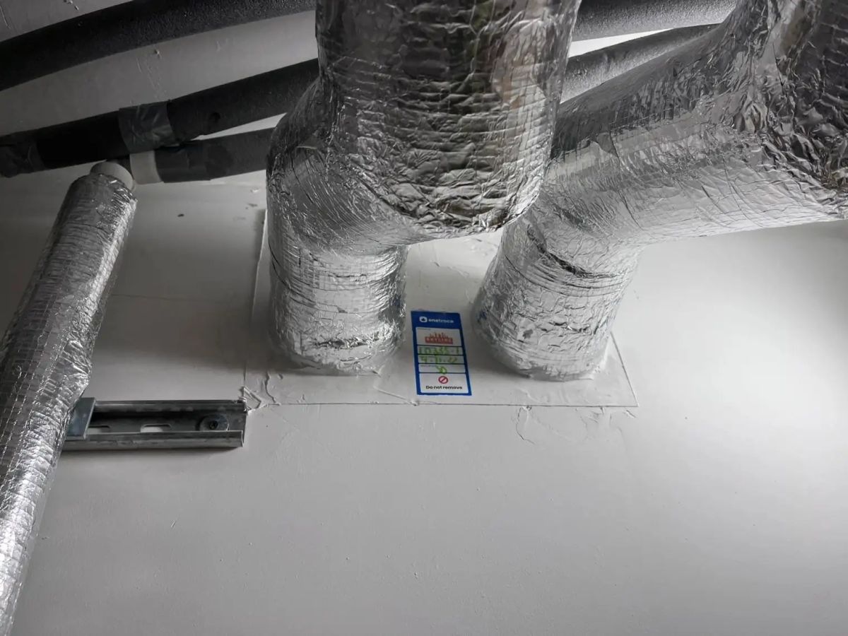 A tagged Skyline penetration seal around insulated ductwork